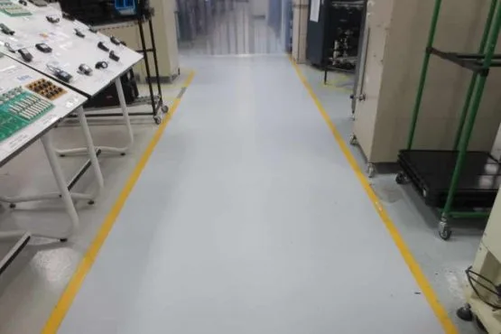 Industrial facility aisle with yellow safety floor lines