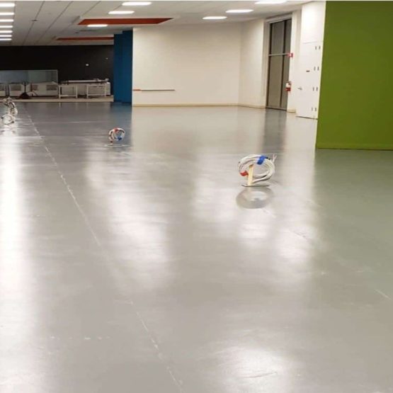 Empty office space with soccer ball and cables