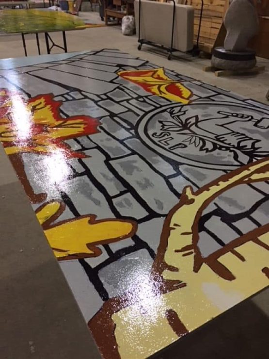 Large painted mural panel in workshop